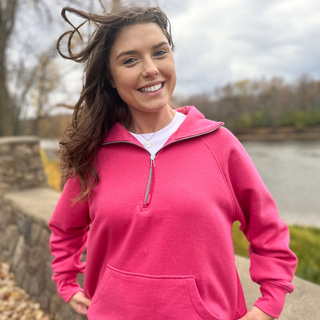 This is a Jordy Boxy Half Zip Pullover in the color pink. 