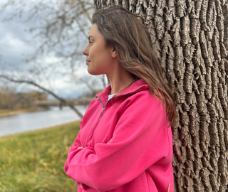 This is a Jordy Boxy Half Zip Pullover in the color pink. 