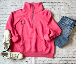 This is a Jordy Boxy Half Zip Pullover in the color pink. It is presented as a flat lay.