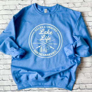 Lake Life: Relax & Unwind Graphic Crewneck in the color Columbia Blue. The brand is a Jerzee NuBlend.