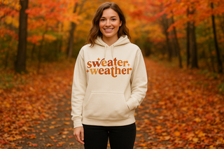 Jerzee hoodie in a cream color with Sweater weather written on the front